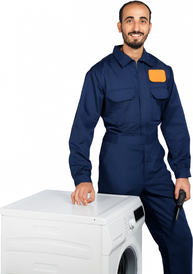 Appliance technician standing beside a washing machine